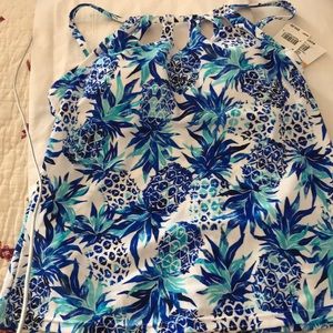 Swimwear top. Blue and white tropical print